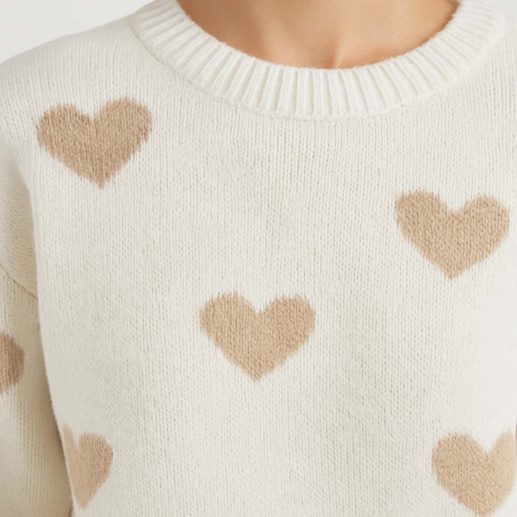 Knit sweater with heart pattern and relaxed fit, styled for cozy everyday wear