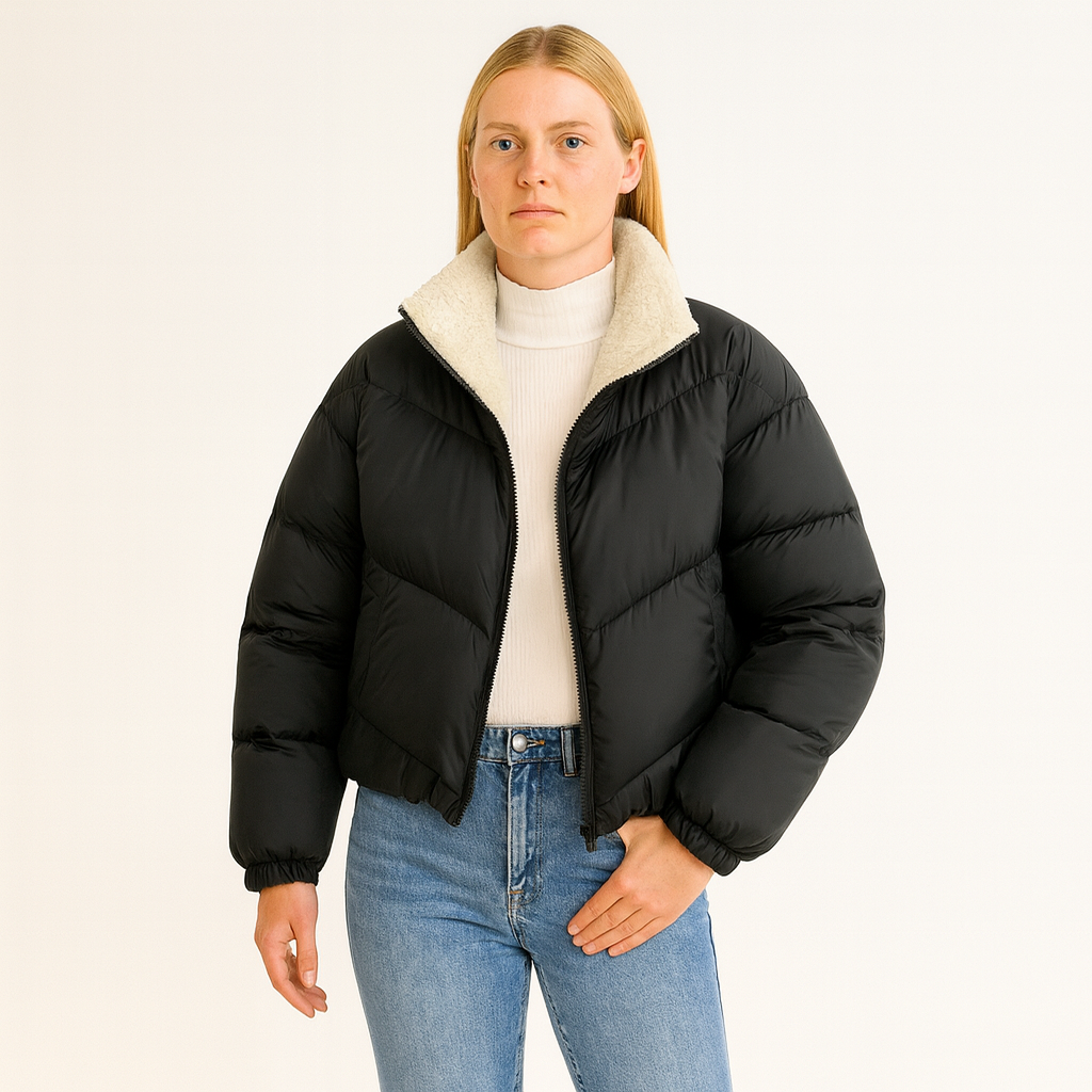 A puffer jacket with a zip-up front, stand collar, long sleeves, and elastic cuffs and hem.