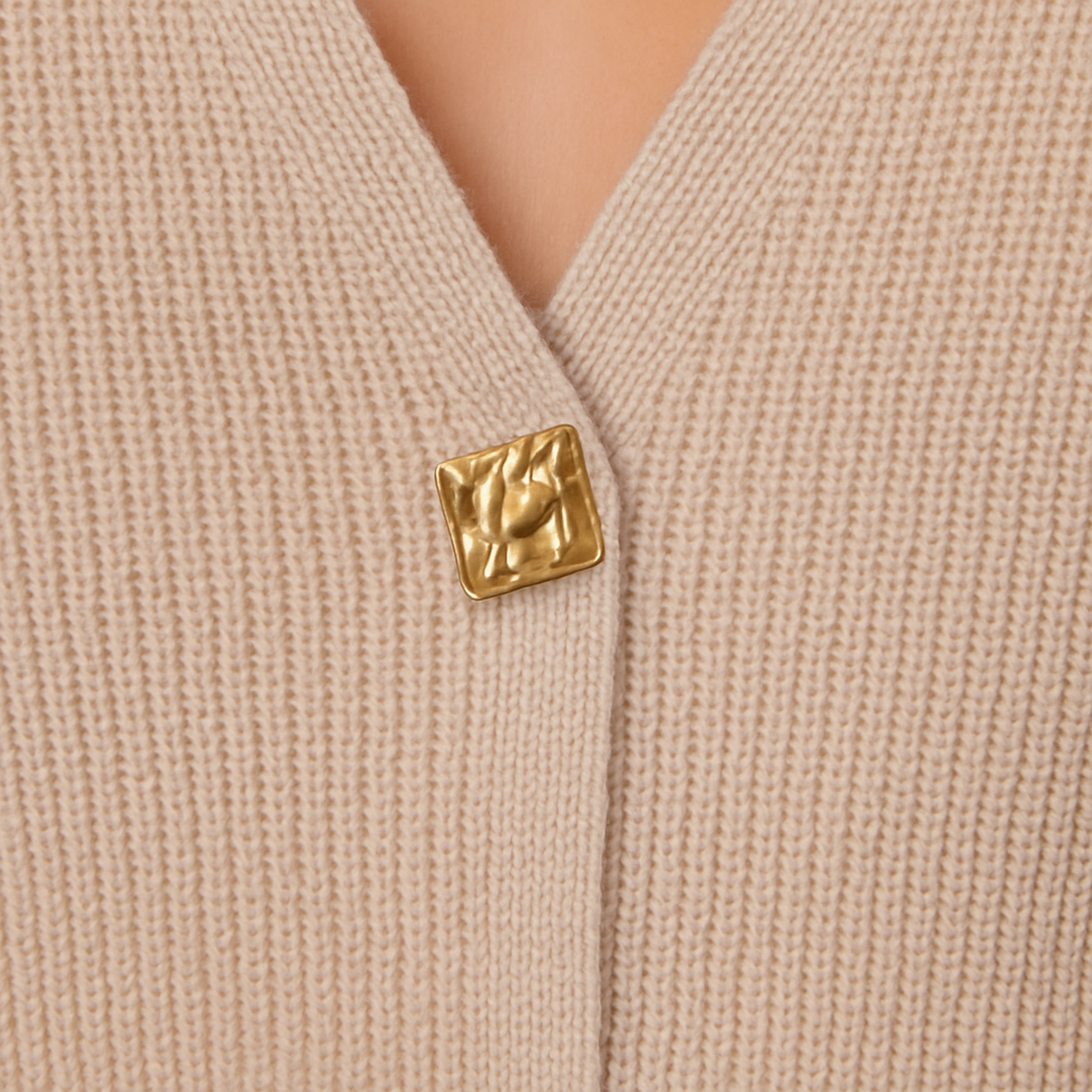 Knit cardigan with V-neckline and button-front design, styled for minimal and elegant everyday wear