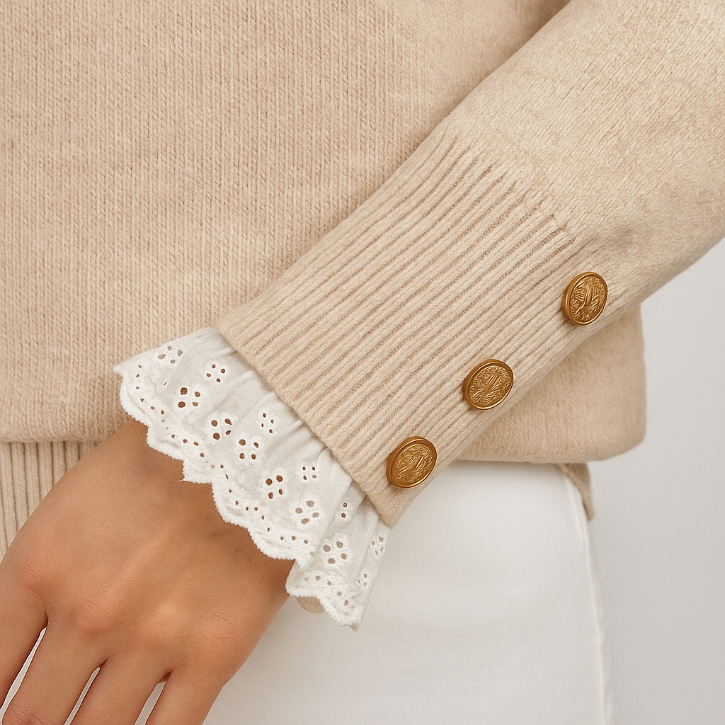 Knit sweater with lace-trim collar and cuffs, accented with gold buttons, styled for elegant feminine looks
