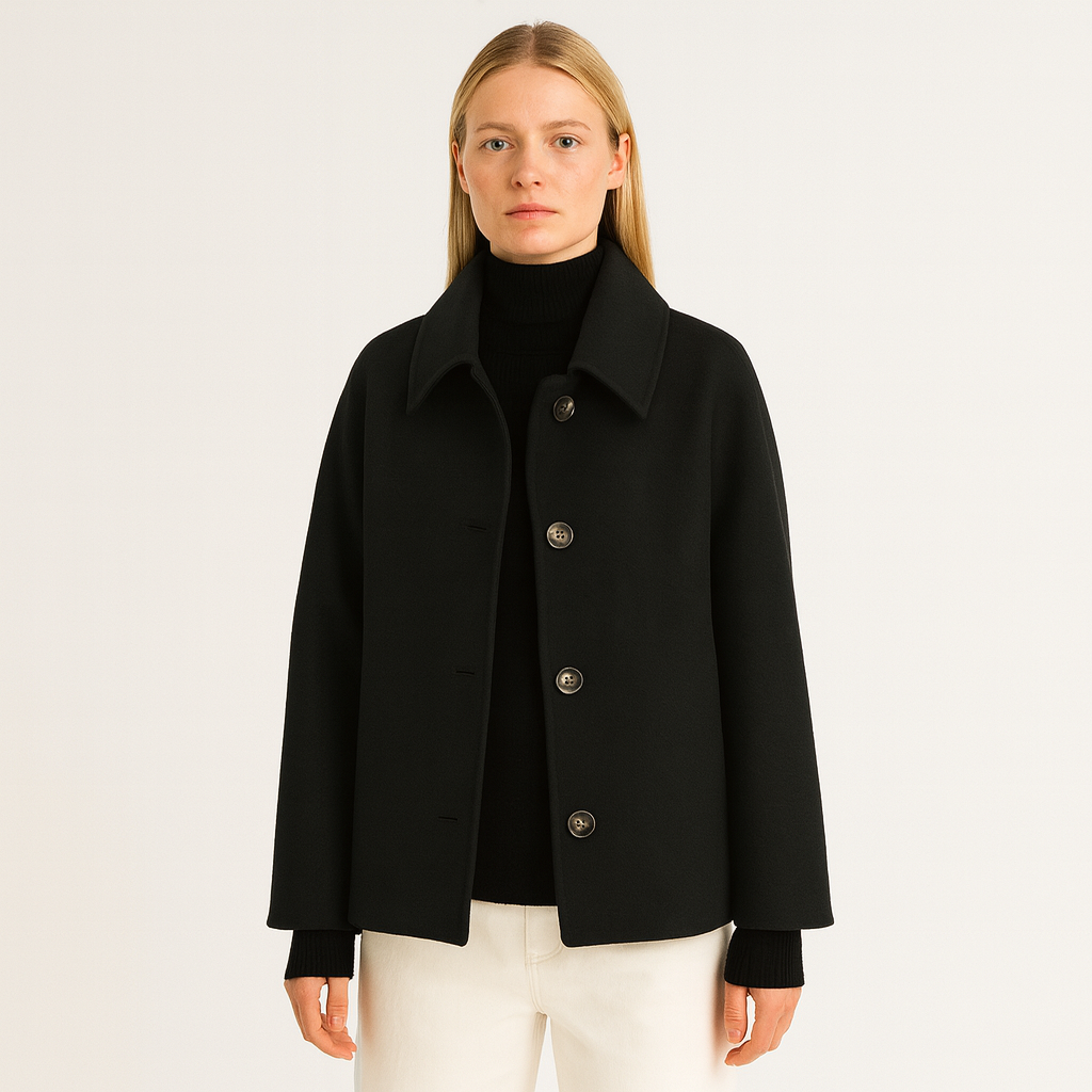 A loose-fit wool-blend coat with a turndown collar, button-up front, long sleeves, and side pockets.
